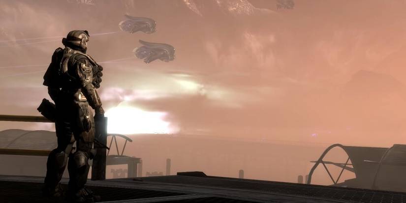 Noble Six looking out at a dusty sky with two Banshees in the background 