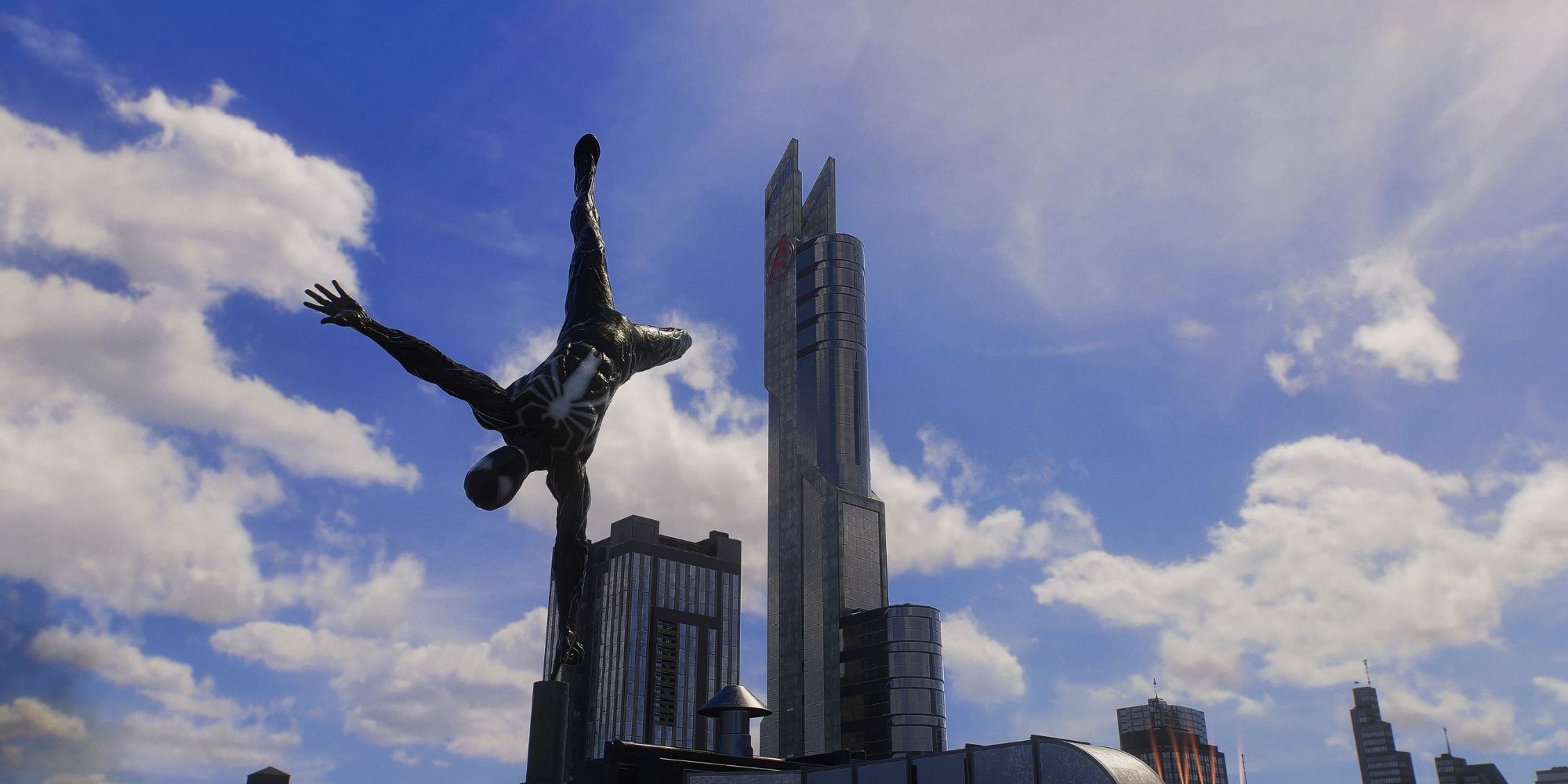 Spider-Man in a black suit doing a handstand with the Avenger's Tower in the background
