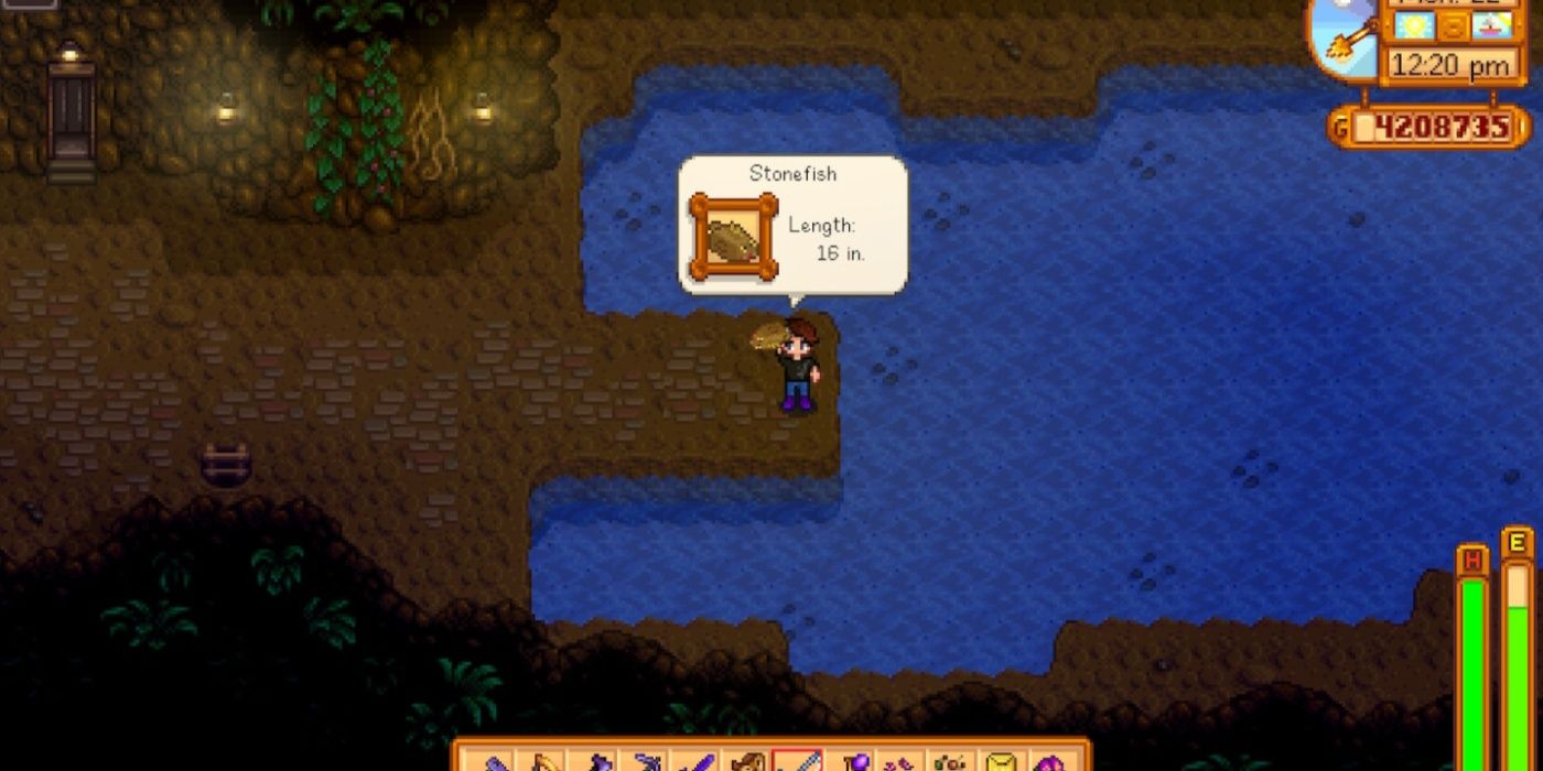 A screenshot of the Stardew Valley mines where the player character is holding up a recently caught Stonefish