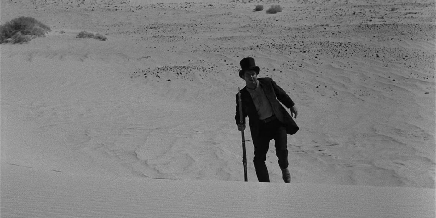 Horn travels through the desert in The Twilight Zone's "A Hundred Yards Over The Rim".