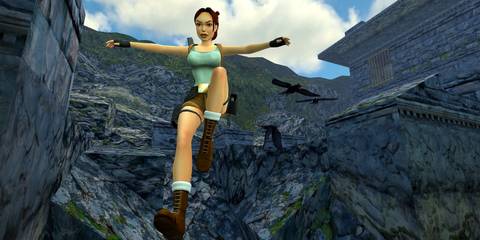Lara Croft dropping down a cliff in Tomb Raider 2.