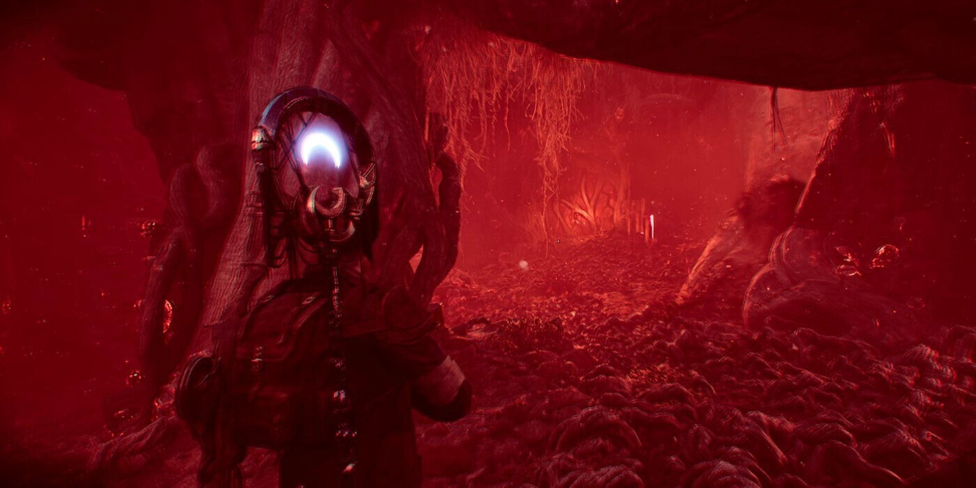 A Remnant 2 player battling a Root Nexus boss in the Infected Abyss