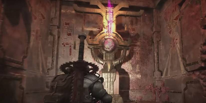 A character in Remnant 2 finding the Blooming Heart relic in a secret vault.