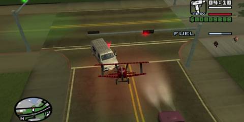 RC plane flying towards a van 