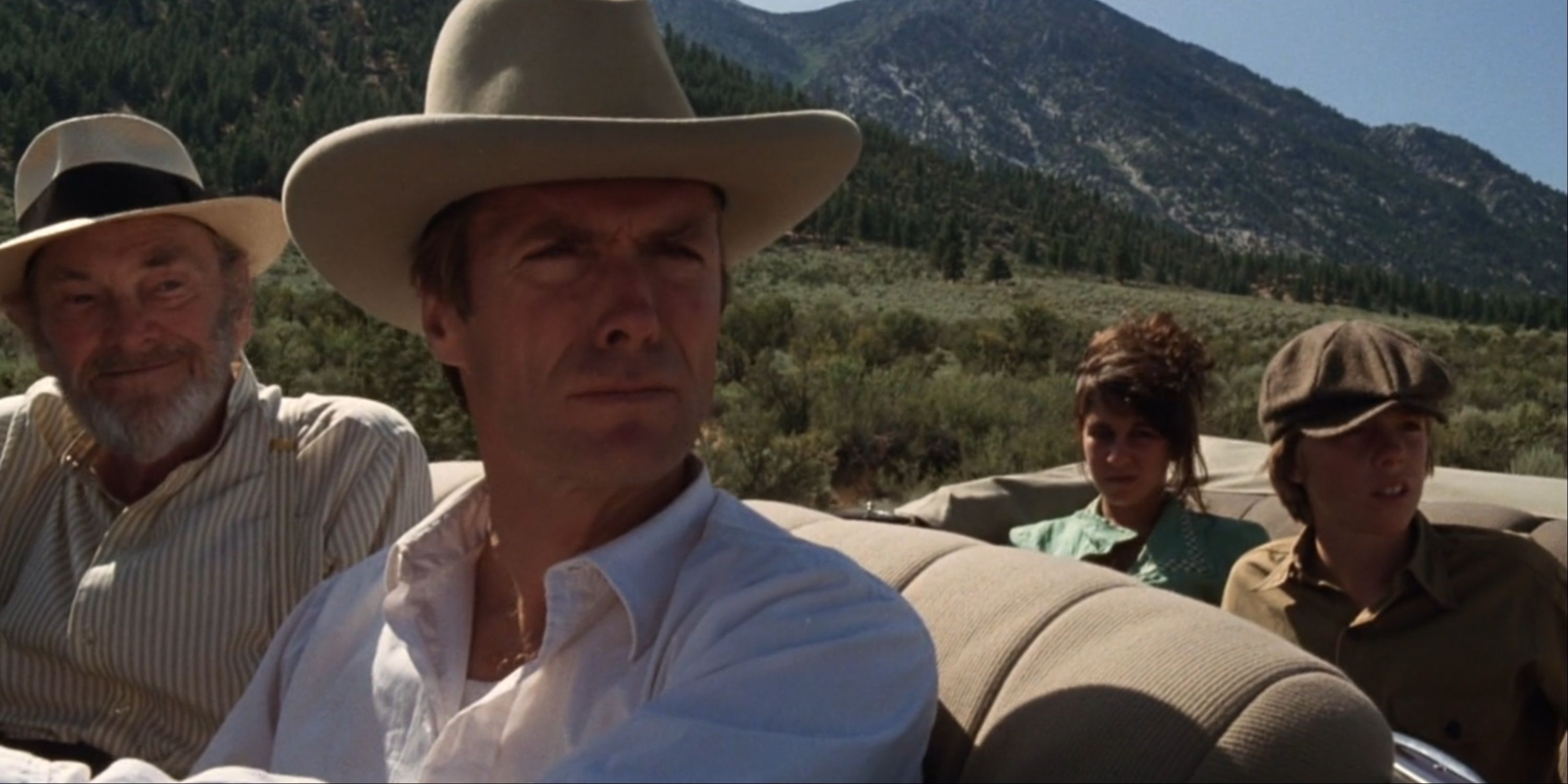 Honkytonk_Man Clint Eastwood and co-stars in a convertable along a valley road