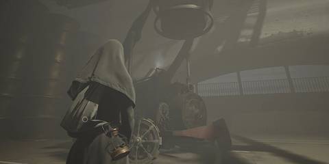 Indika standing in front of the forklift