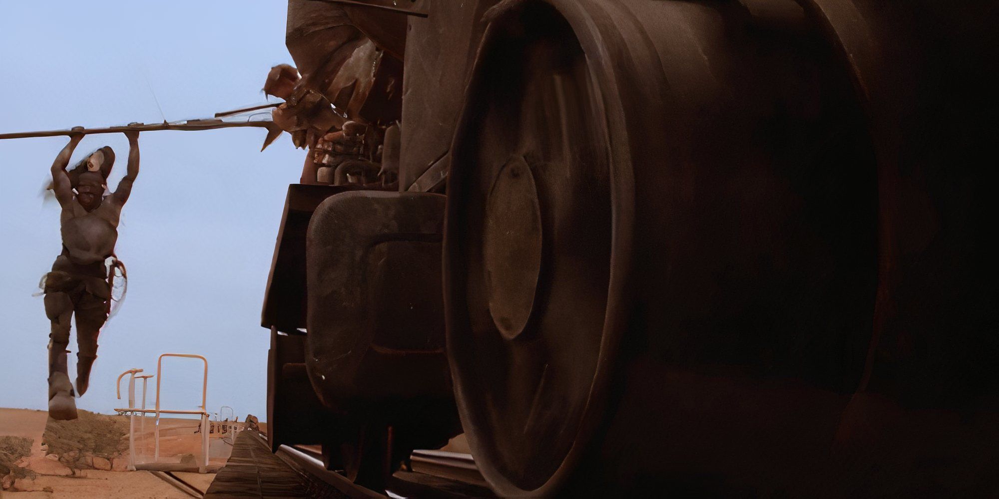 Ironbar hanging onto a car in Mad Max Beyond Thunderdome