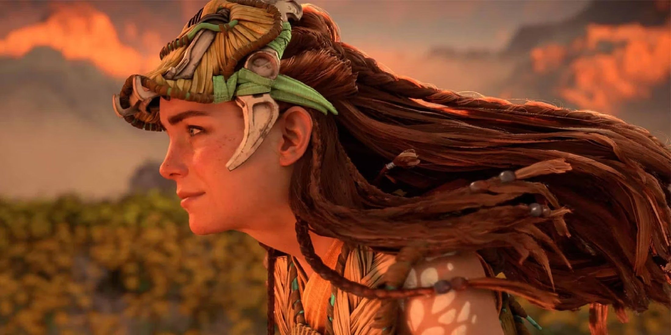 horizon forbidden west close up of aloy in profile smiling and wearing utaru armor
