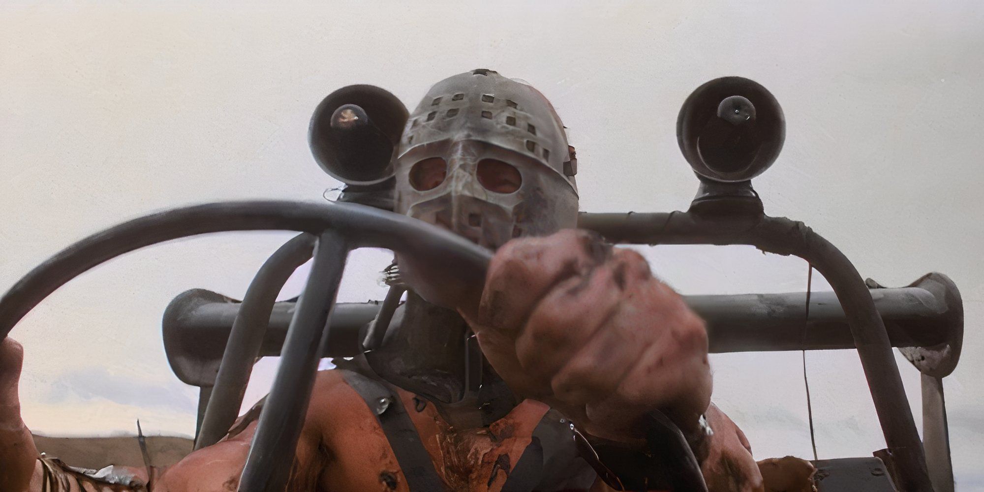 Lord Humungous driving in Mad Max 2 The Road Warrior