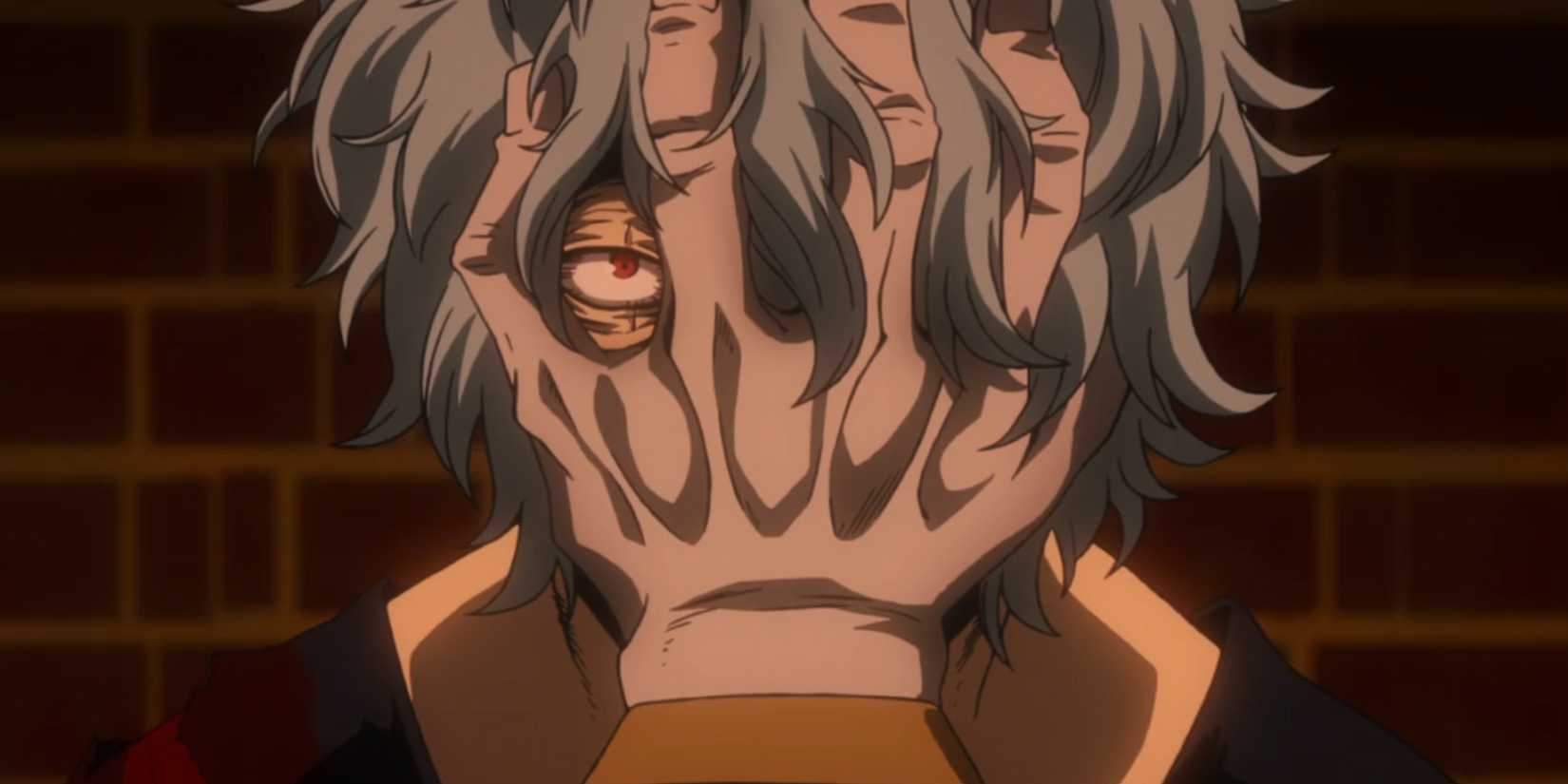 Tomura Shigaraki looks at the viewer with a hand over his face.