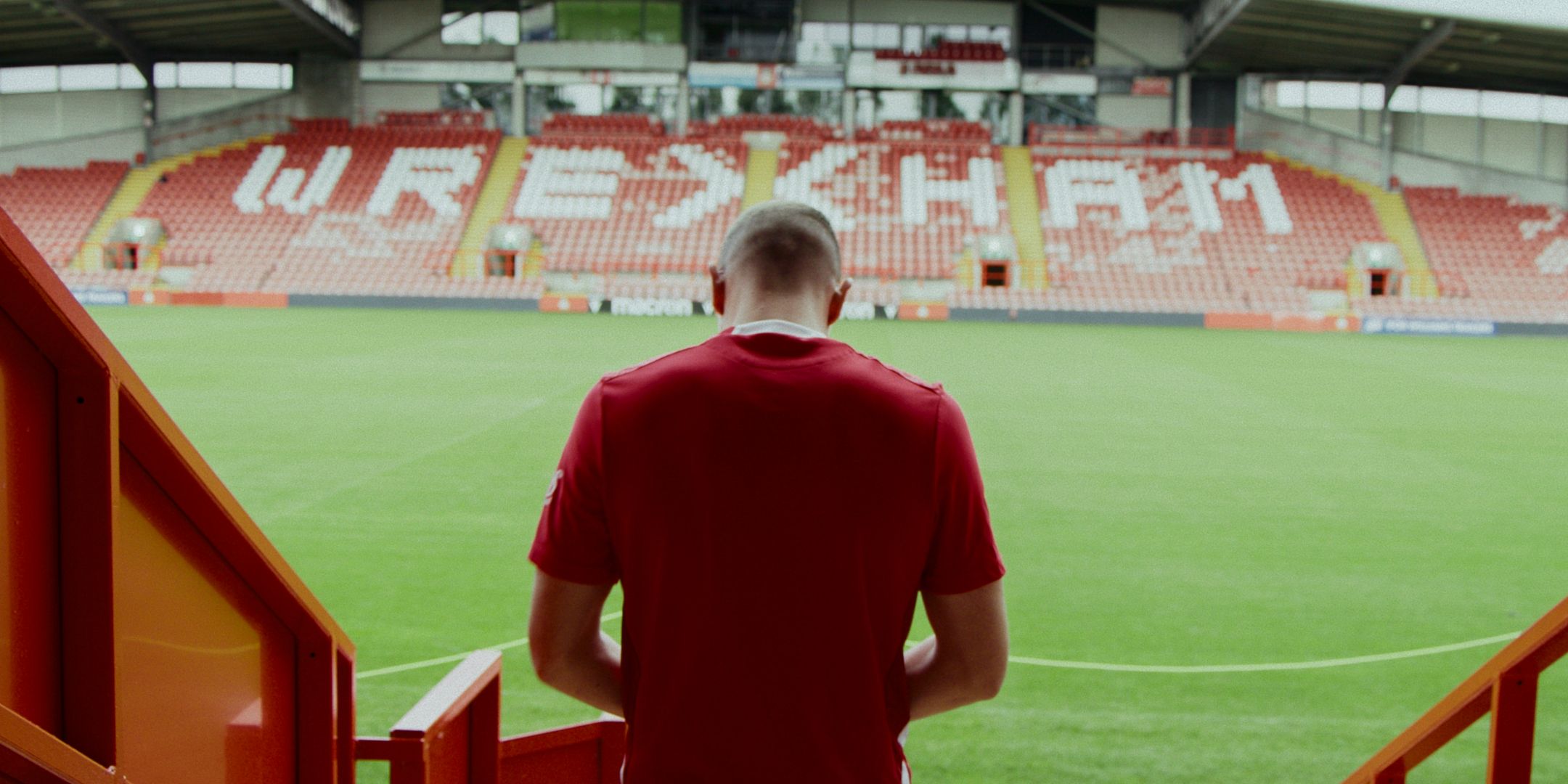 Wrexham striker Paul Mullin back from Racecourse stadium stands