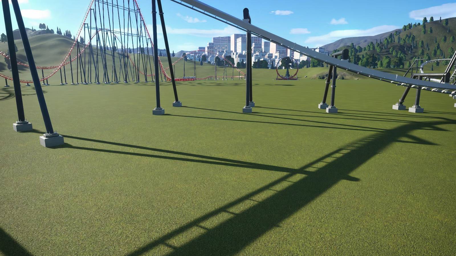 A ride and a coaster in Planet Coaster