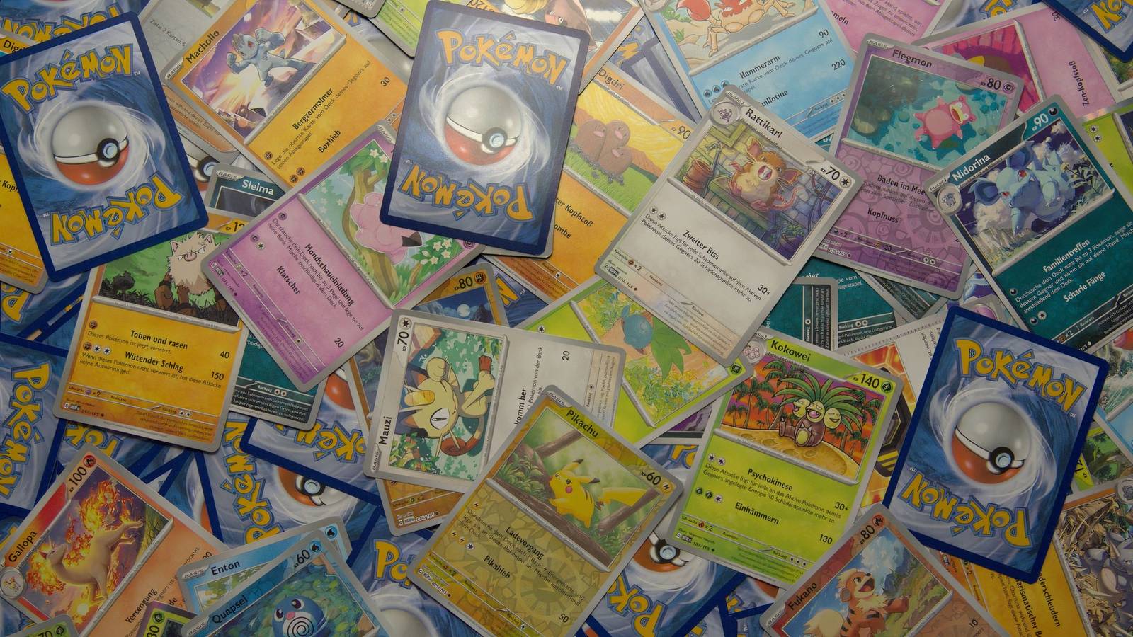 a pile of pokemon tcg cards.
