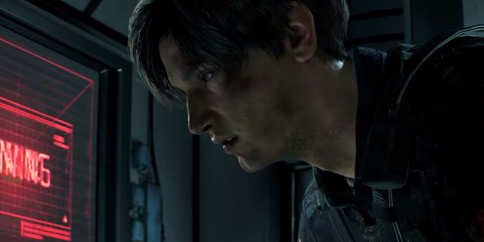 leon looking at a computer screen in the nest lab in re2
