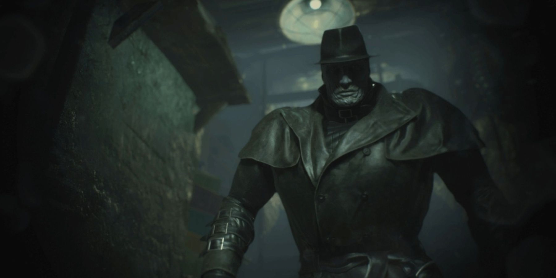 Mr X standing ominously in the dark in Resident Evil 2 remake