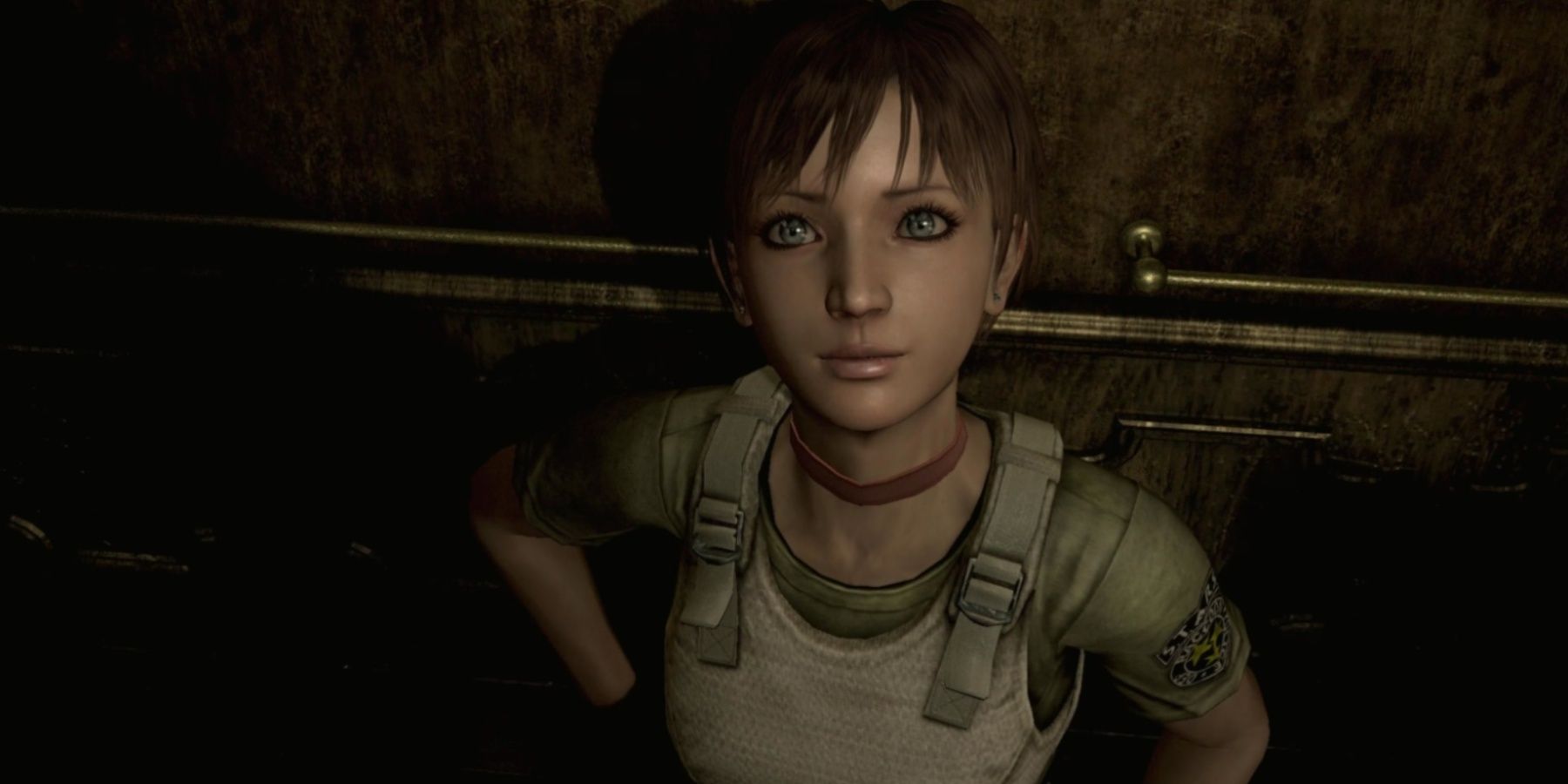 Resident Evil Zero Rebecca looking up at viewer while leaning on a wall