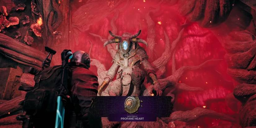 The Remnant 2 character is being given the Profane Heart by The Root Statue.