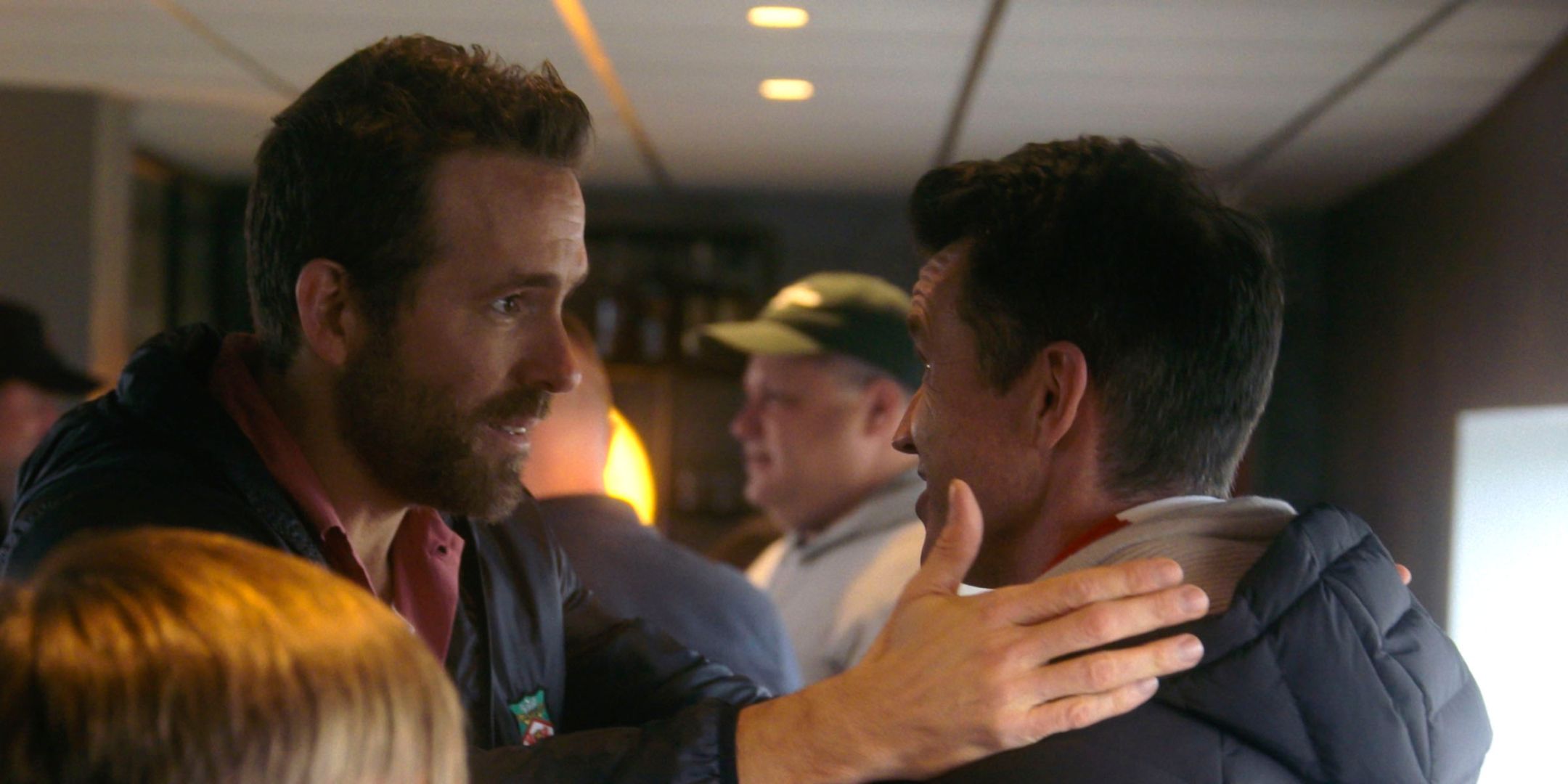 Ryan Reynolds and Rob McElhenney talking up close