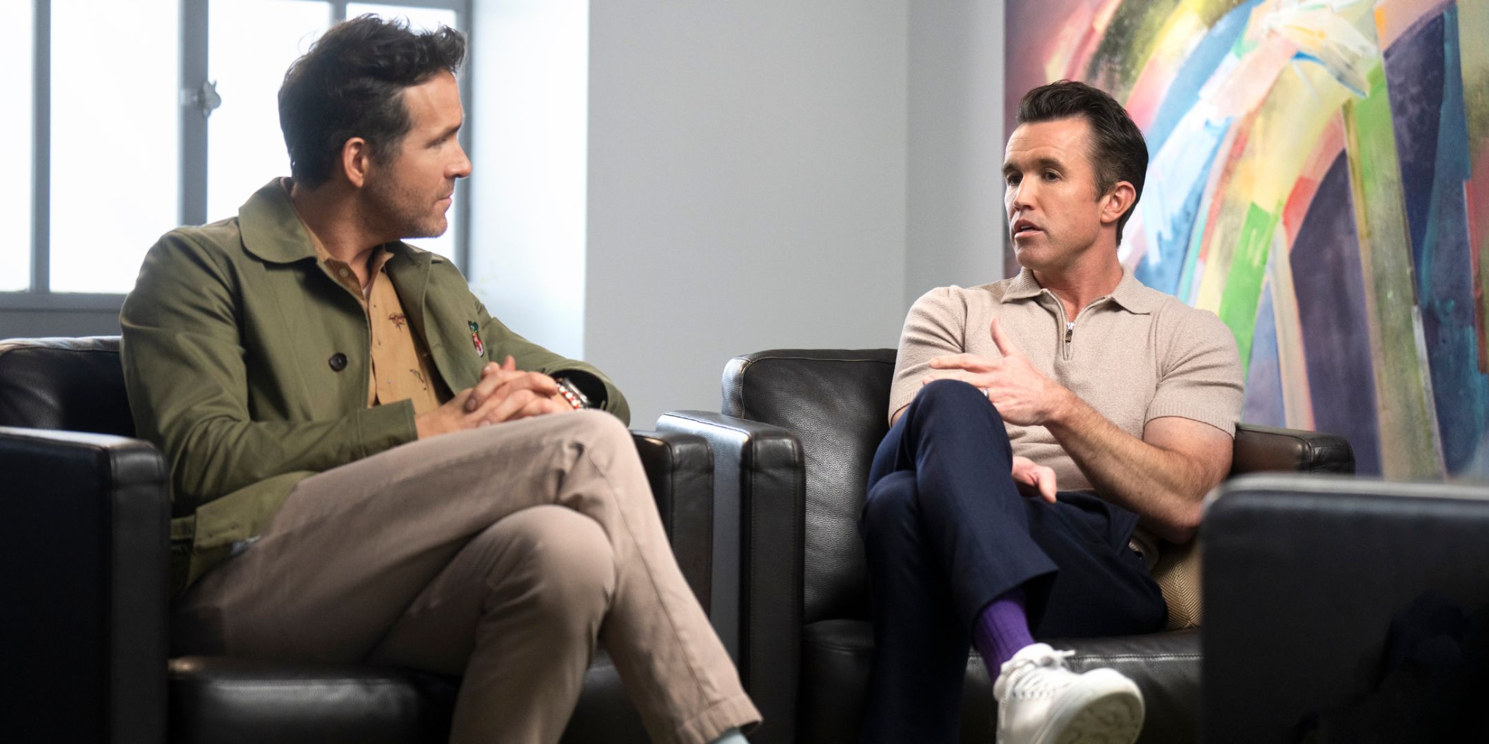 Ryan Reynolds and Rob McElhenney sitting in couches for Welcome to Wrexham interview 