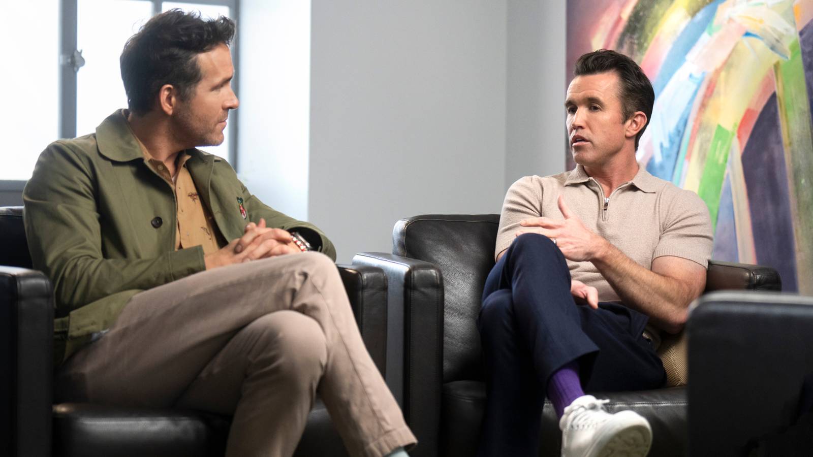 Ryan Reynolds and Rob McElhenney sitting in couches for Welcome to Wrexham interview 