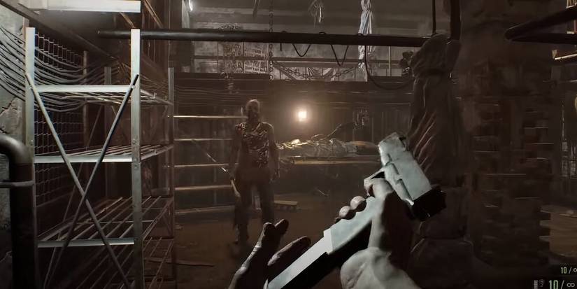 Player reloading a handgun with Jack Baker in the background in Resident Evil 7