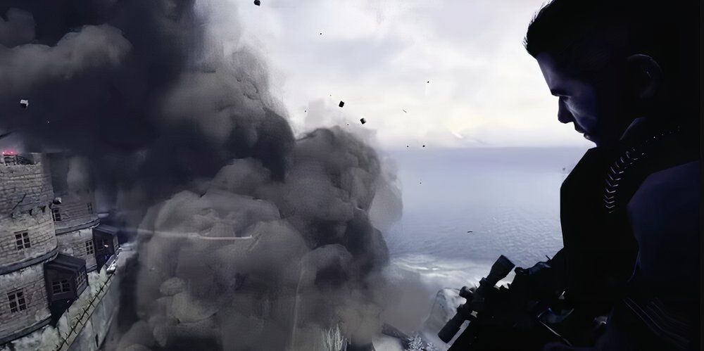 Soap sitting on the edge of a helicopter watching a fortress explode 