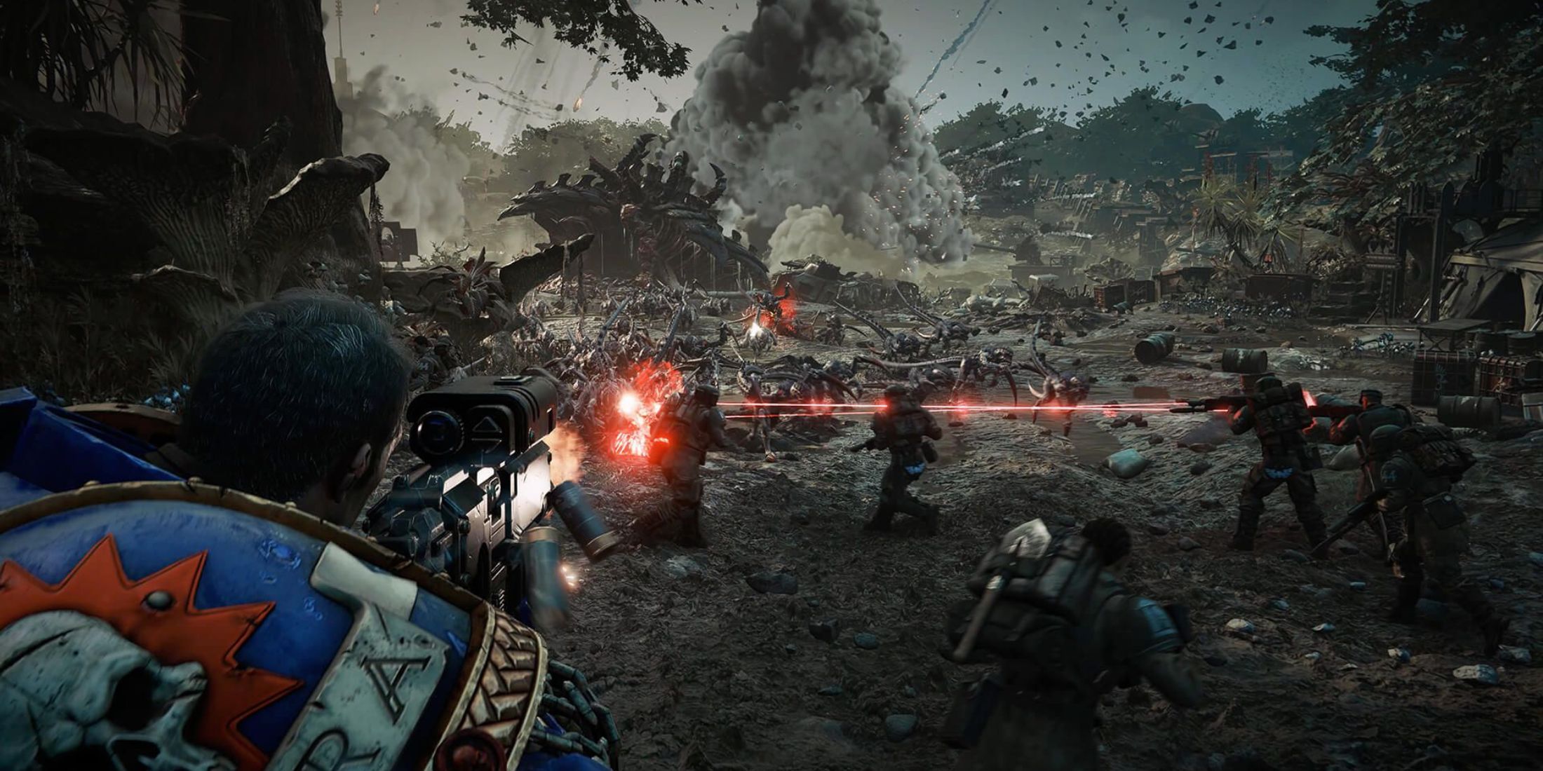 Gameplay image from Space Marine 2 showing Lieutenant Titus gunning down Tyranids