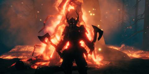 A character wielding hatchets surrounded by flames in Valheim