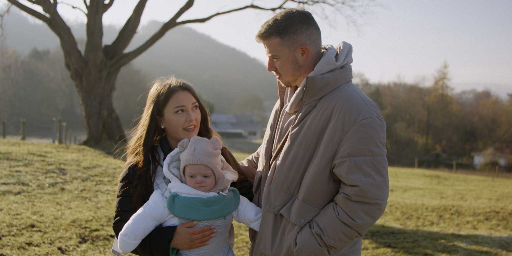 Wrexham player James Jones with wife Chloe and son Jude in Welsh plains