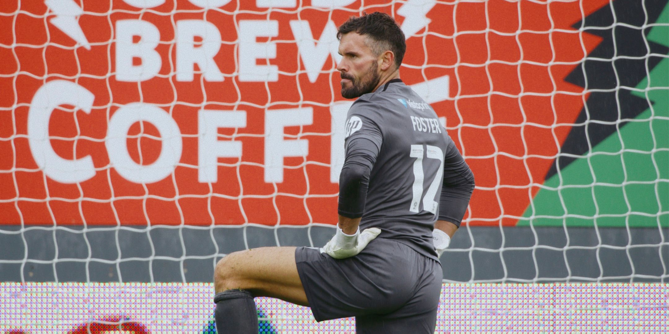 English goalkeeper Ben Foster kneeling in Wrexham goal