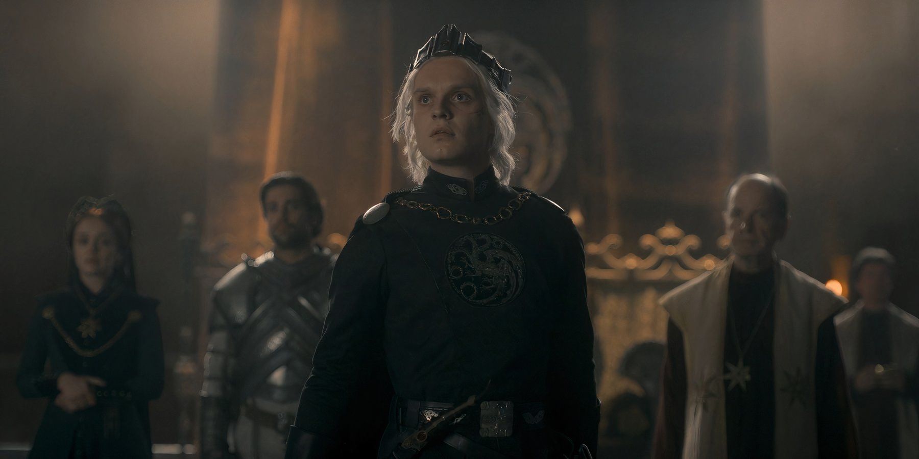 Alicent Hightower and Criston Cole watching King Aegon Targaryen being crowned in House of the Dragon
