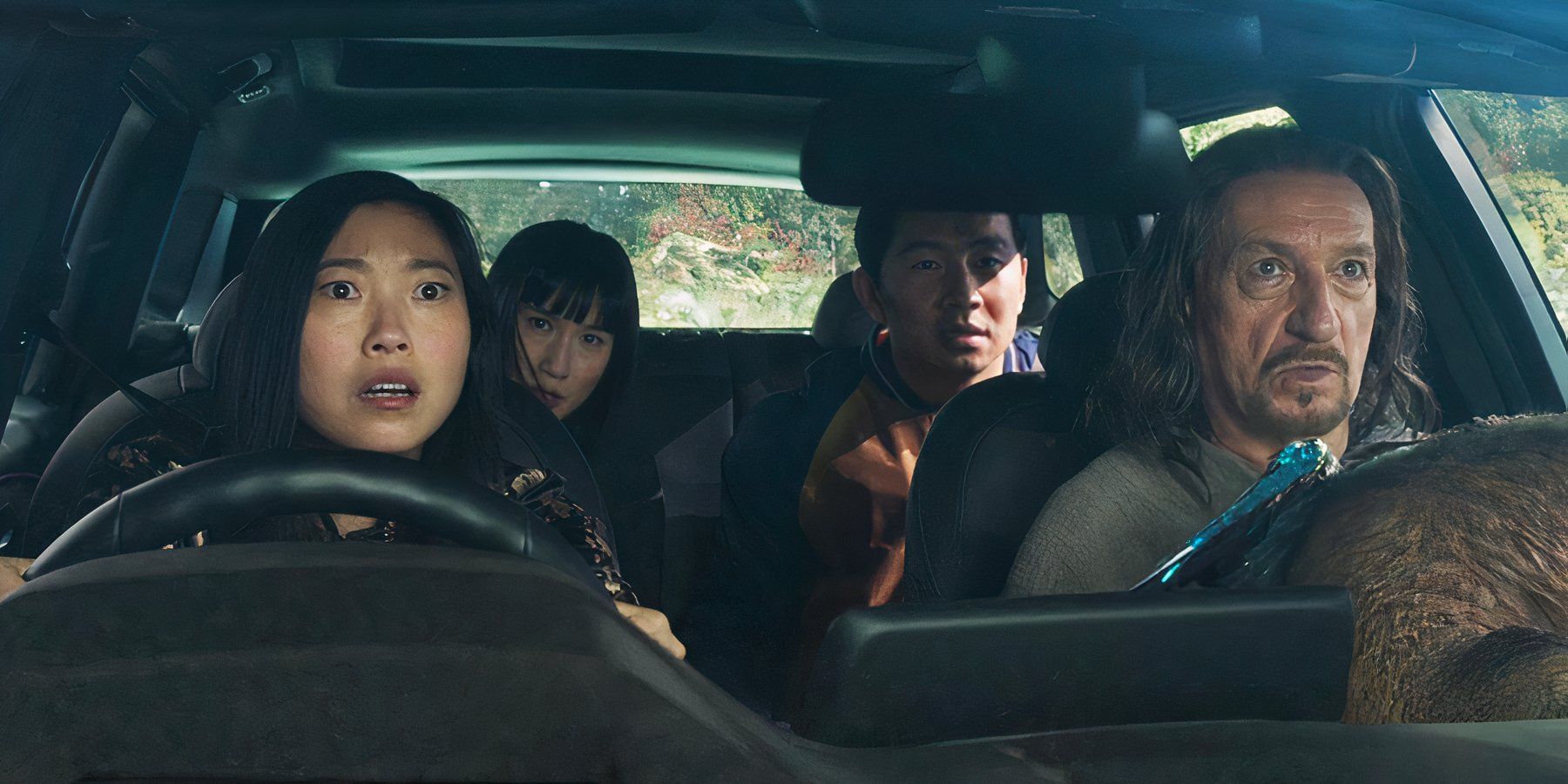 Ben Kingsley, Meng'er Zhang, Simu Liu, and Awkwafina on a road trip in Shang-Chi and the Legend of the Ten Rings (2021)