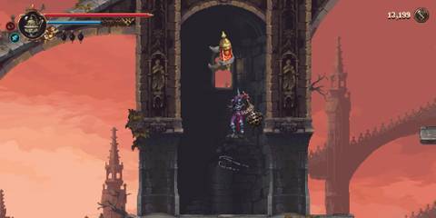 Character fighting an enemy in Blasphemous 2