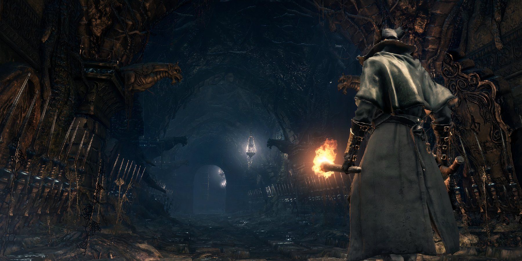 a hunter walking down a dark corridor in bloodborne