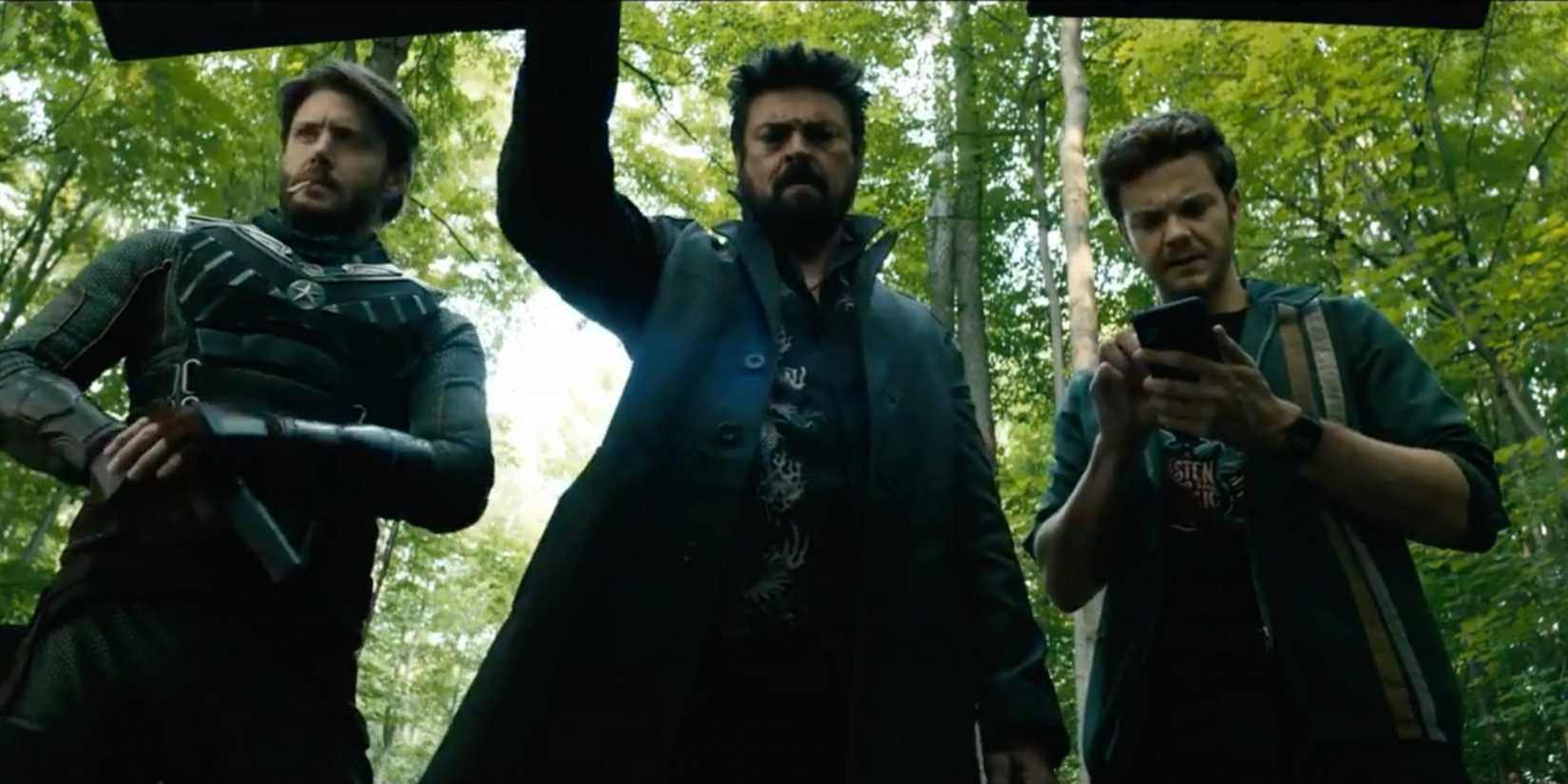 Soldier Boy, Butcher, and Hughie standing over a car trunk in The Boys