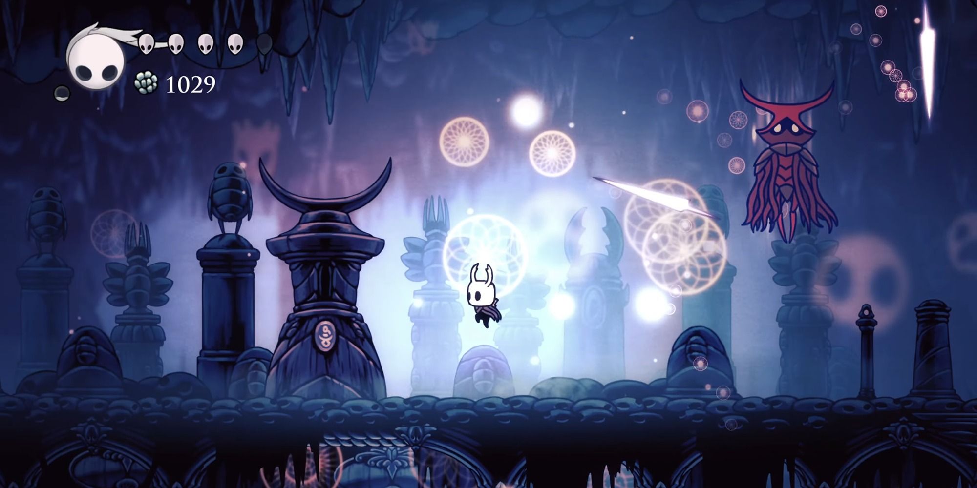 Character fighting a boss in Hollow Knight