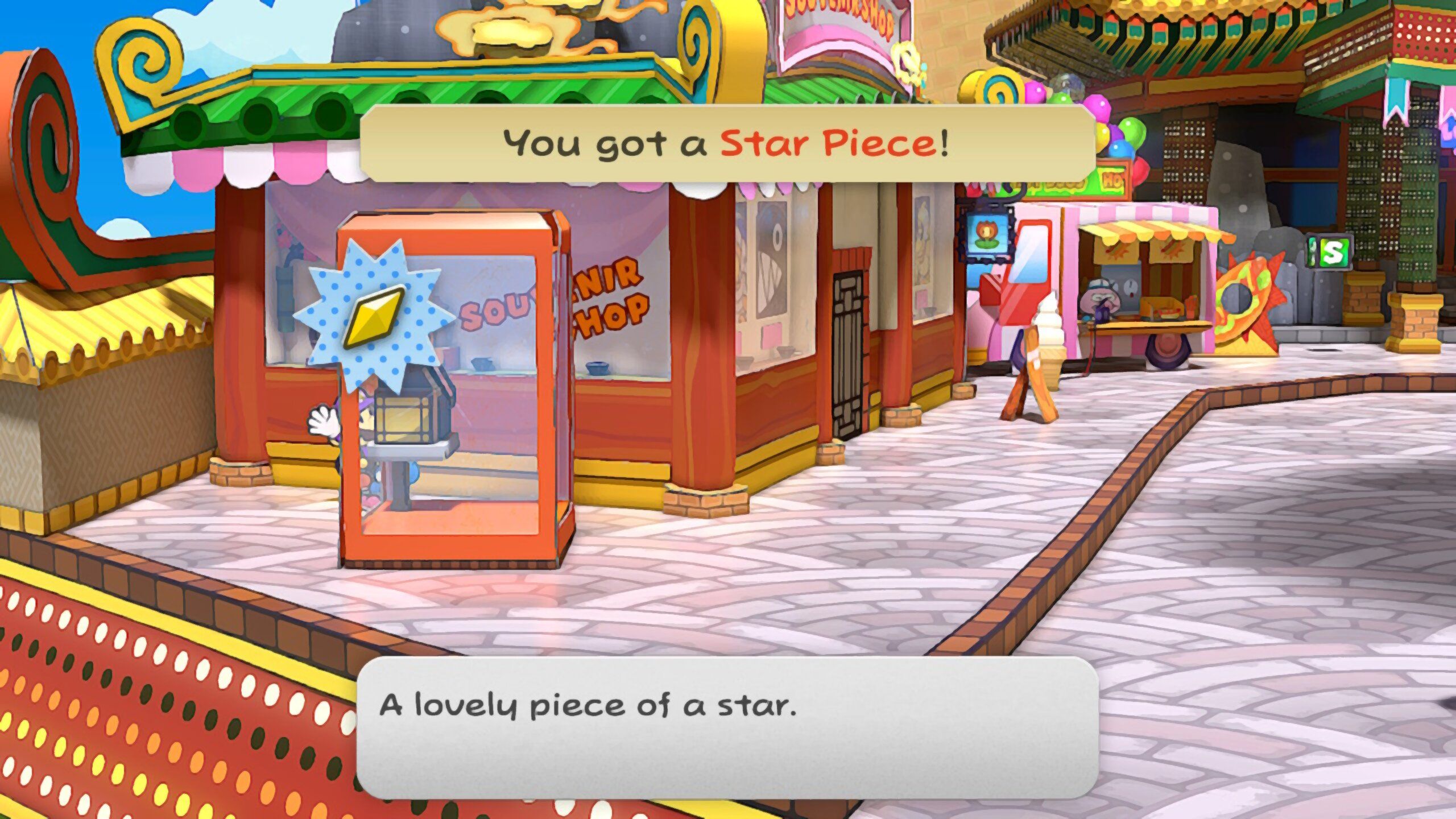 Image of a star piece behind a phone booth in Paper Mario TTYD