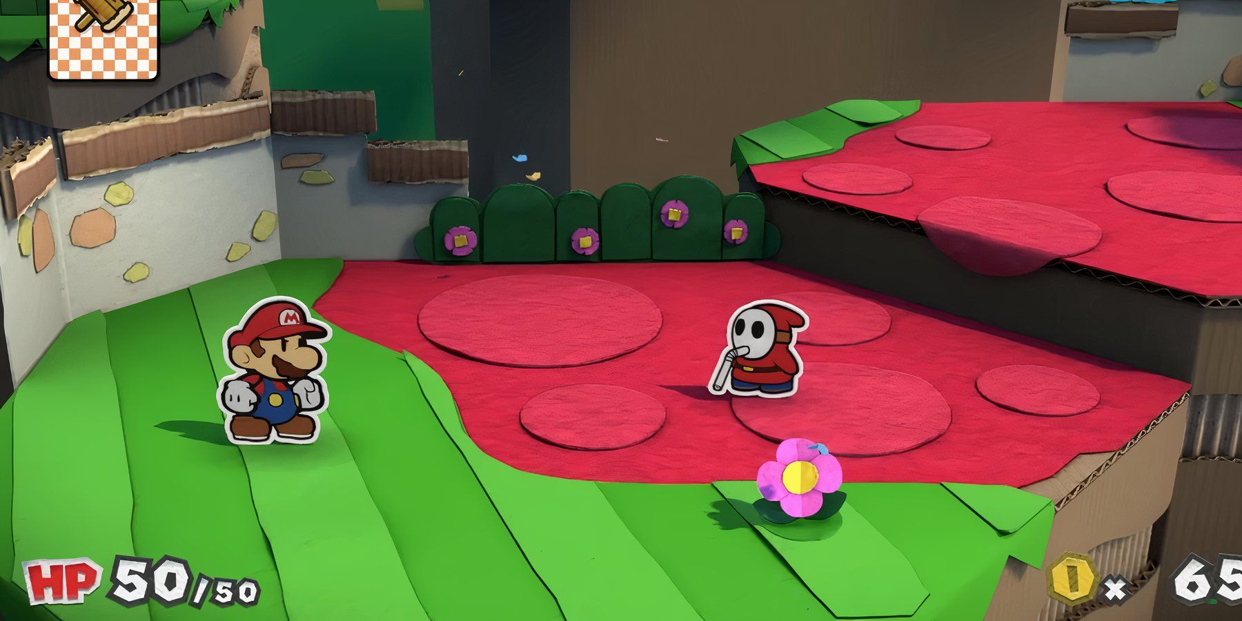 mario getting ready to fight a shy guy in color splash