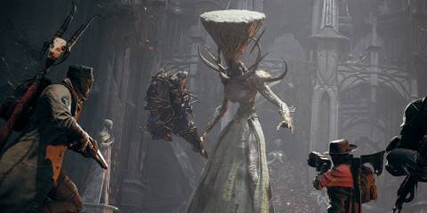 Two player characters fighting a boss in Remnant II.
