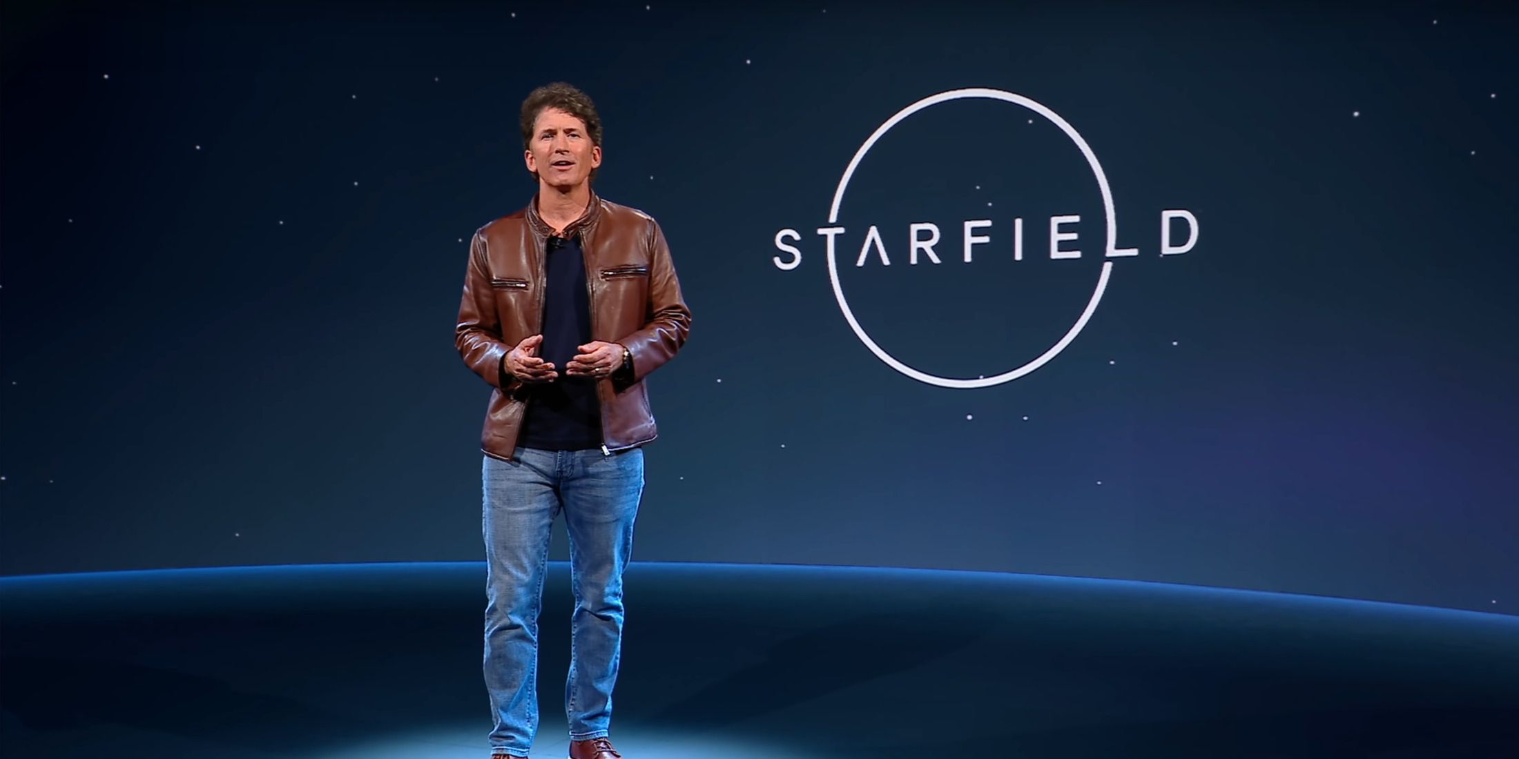 todd howard next to a starfield logo