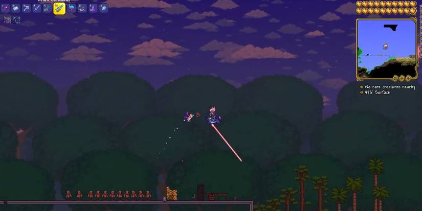 Terraria Scutlix firing laser in the air at night