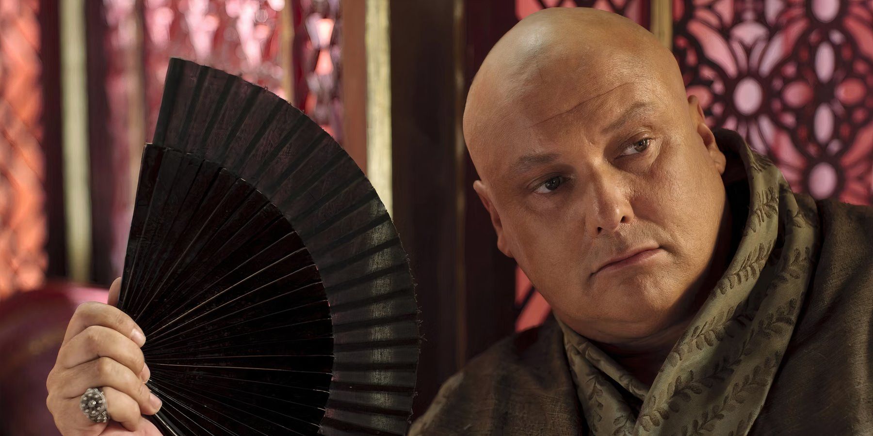 Varys with a fan in Game of Thrones
