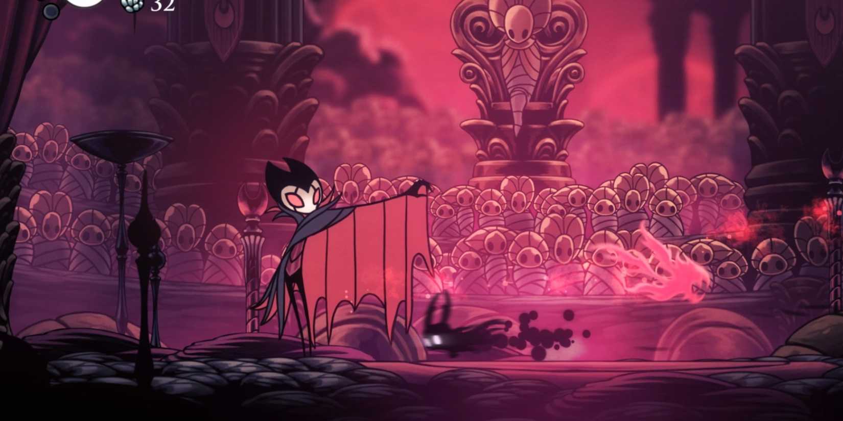 the knight engaging with a boss in hollow knight