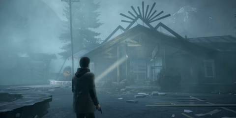 alan wake shining flashlight on run down building