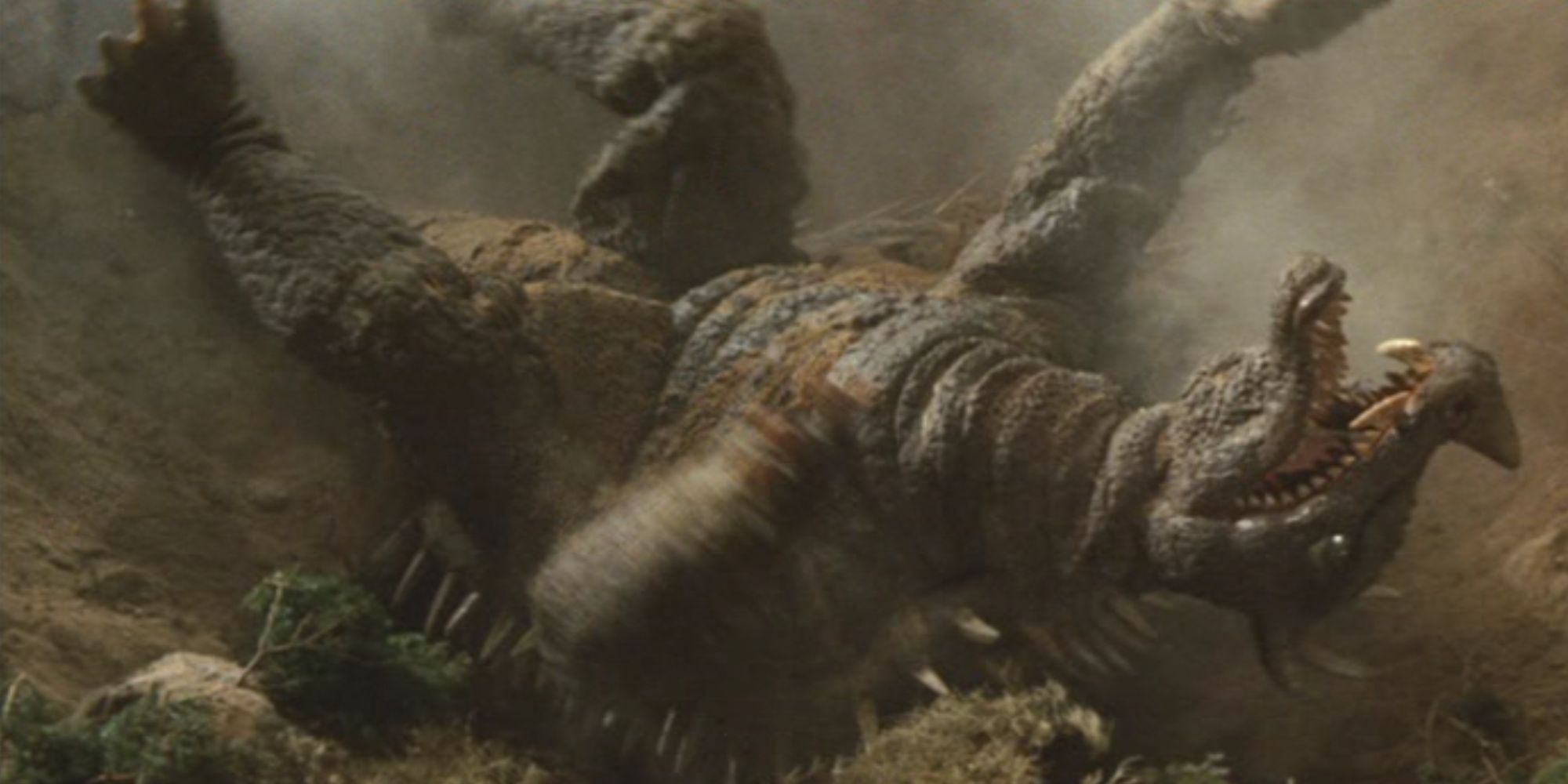 Anguirus gets thrown around by King Ghidorah.