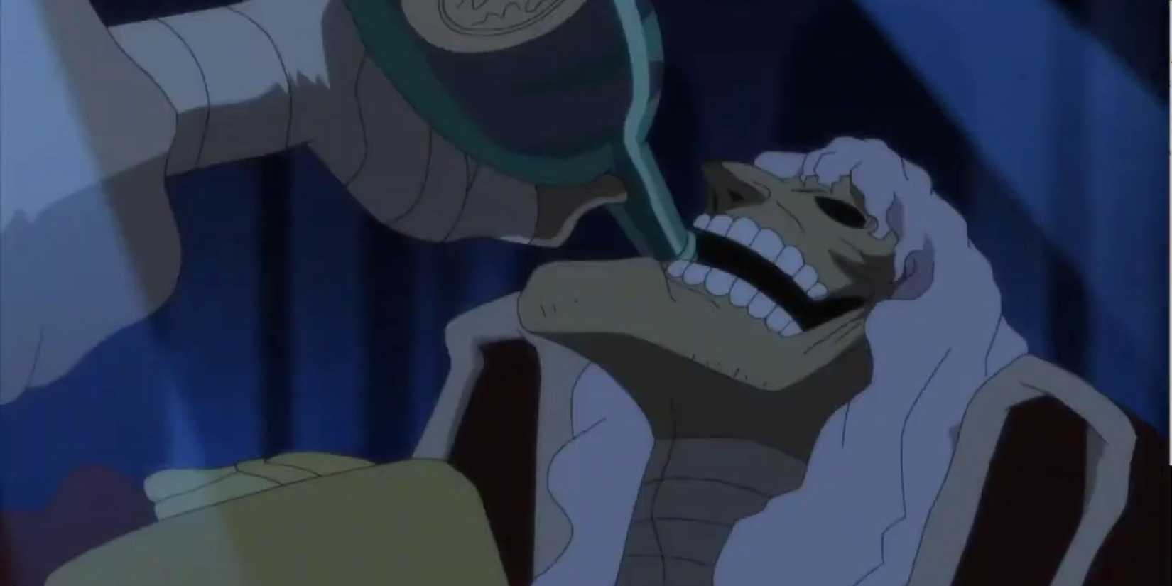 Captain John takes a sip from his bottle as he's revived by Absalom.