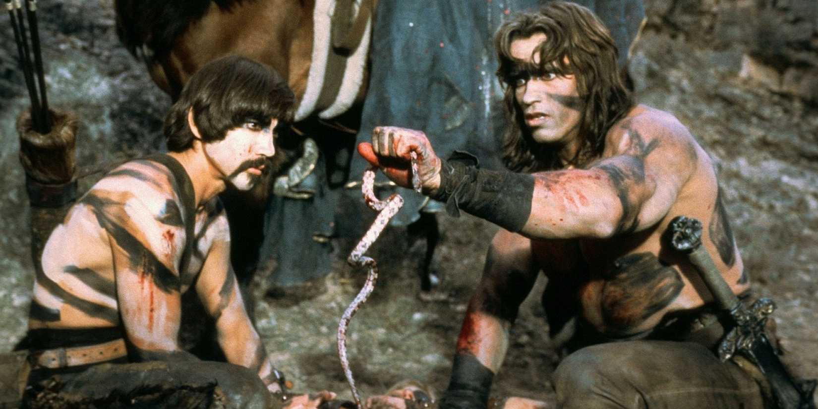 Conan the Barbarian - Arnold Schwarzenegger Holding A Snake