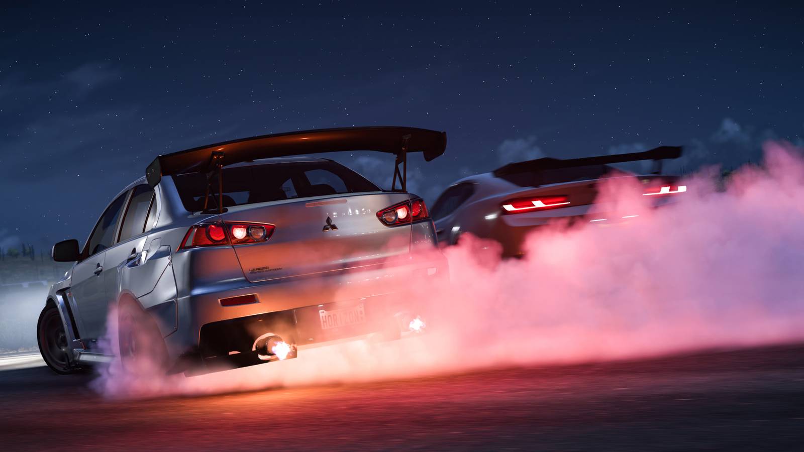 mitsubishi evo x and chevrolet camaro drifting in forza horizon 5