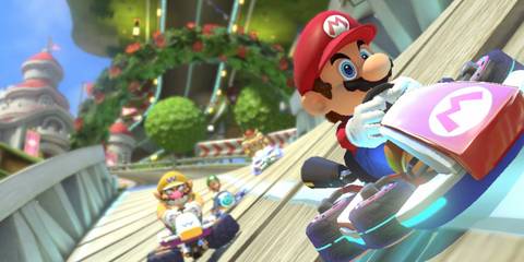 mario racing with wario behind him in mario kart 8