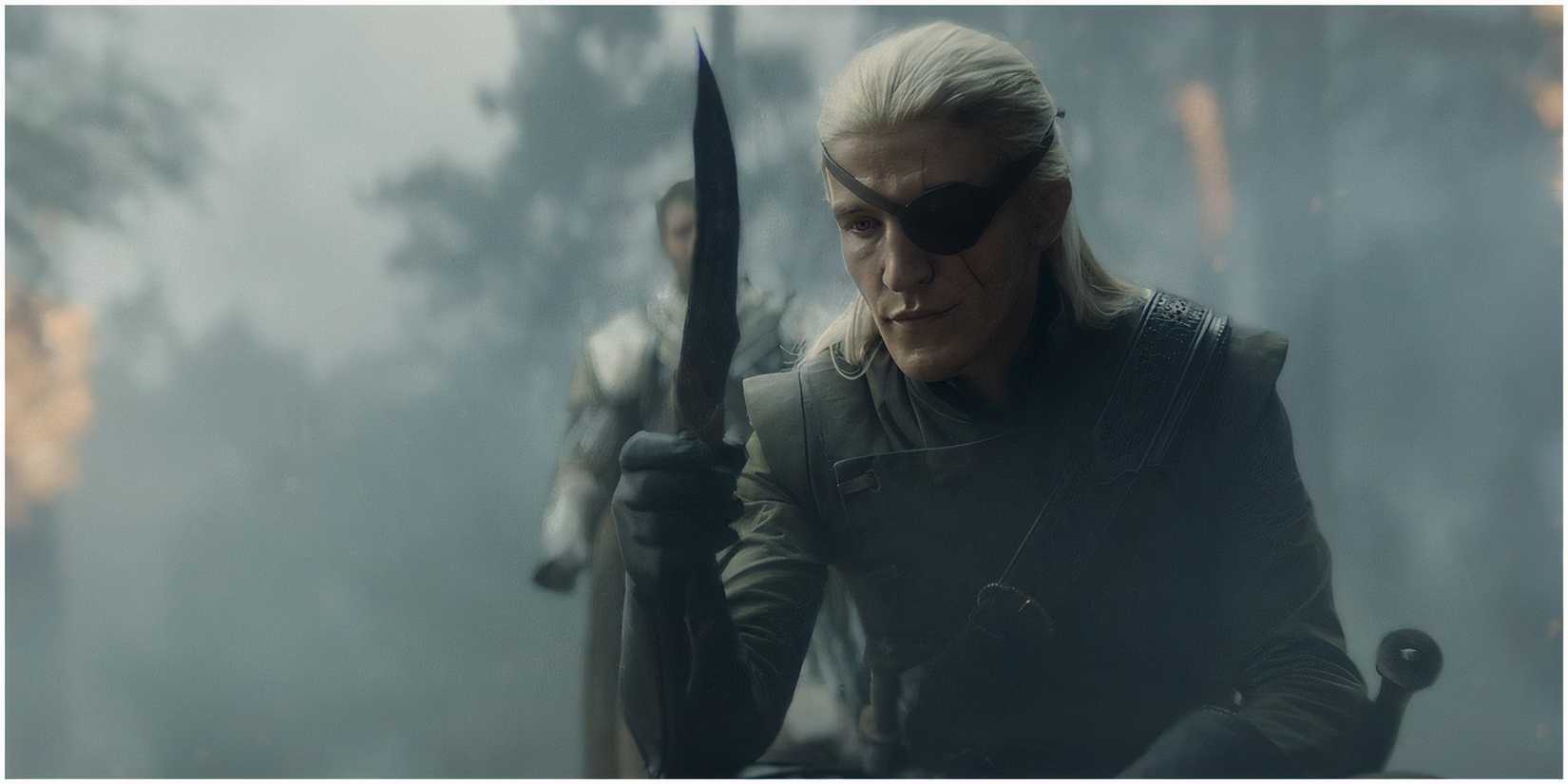 Aemond Targaryen holding the Valyrian steel dagger as Criston Cole watches in House of the Dragon.